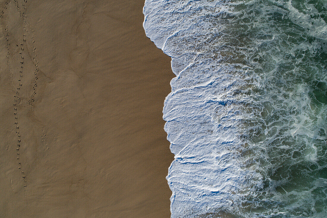 Drone view of wave on shore at beach, Porto, Portugal