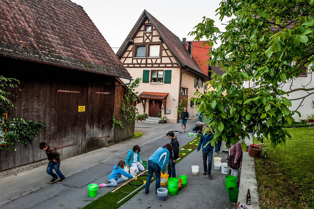 People arranging petals for the flower carpet, Corpus Christi, Feast of Corpus Christi, procession, Sipplingen, Lake Constance, Baden-Wuerttemberg, Germany, Europe