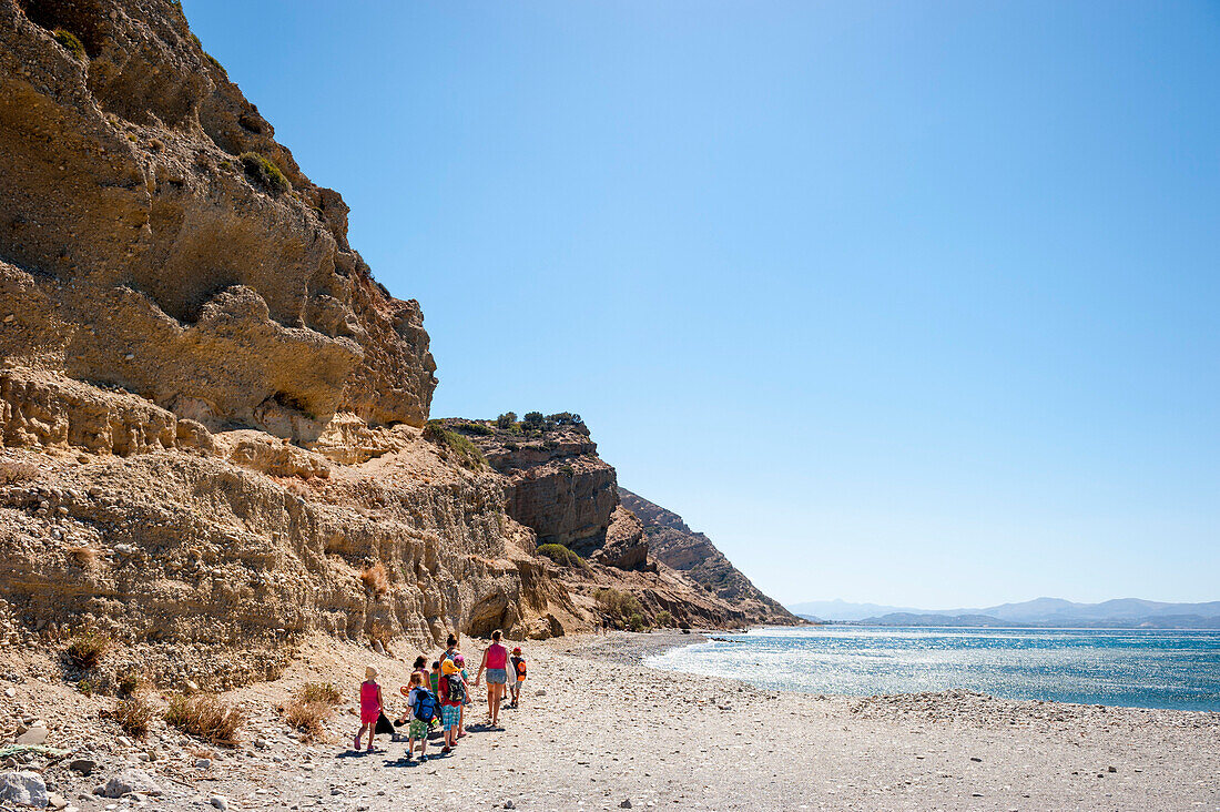 Children walking on the beach, Agia Galini, Crete, Greece, Europe