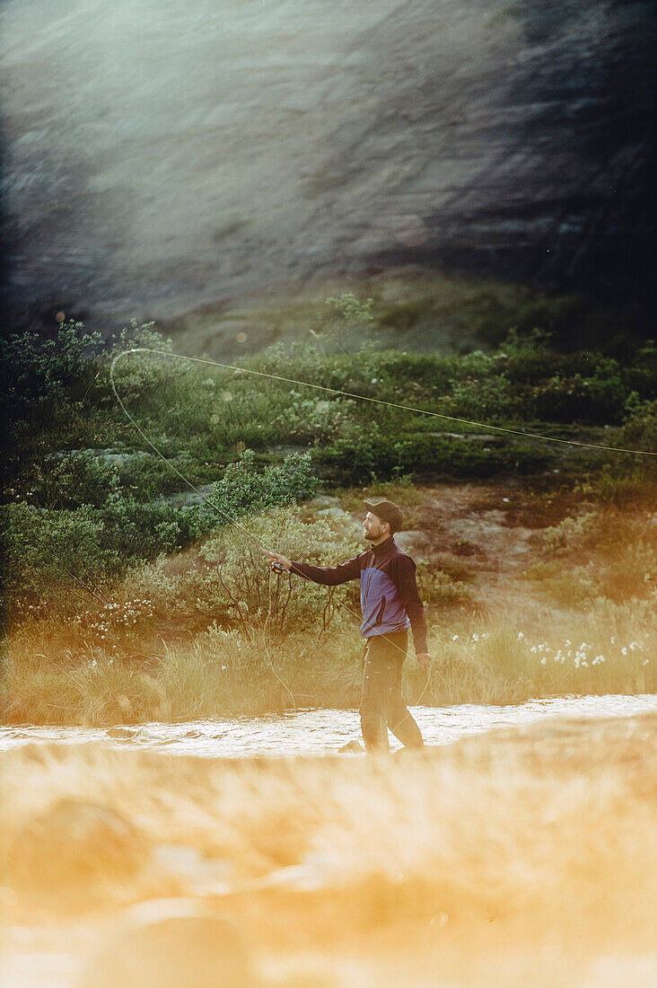 Man fishing in the nature of Greenland, greenland, arctic.