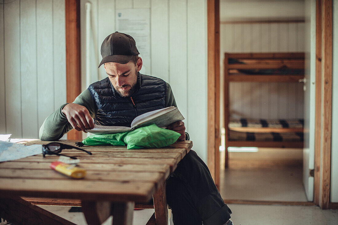 Hiker in a cabin, greenland, arctic.