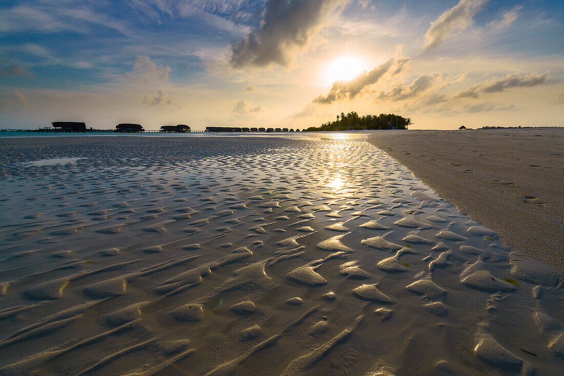 structures in the sand on the beach of Cocoa Island, Maafushi, Maledives
