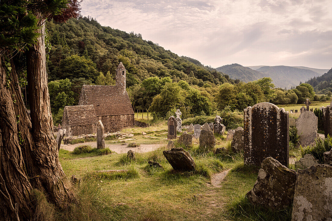 old tombstones in front of St. Kevon’s church, Glendalough Monastic Site, County Wicklow, Ireland, Europe