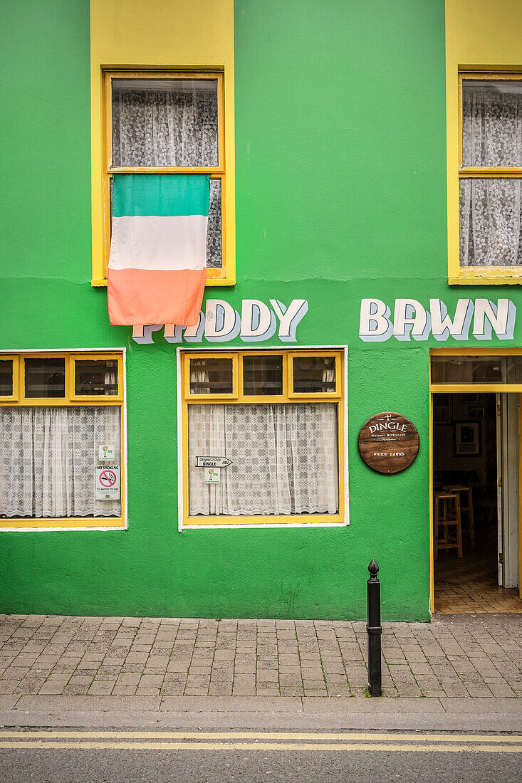 Irish flag at window of bar Paddy Bawn, green house, Dingle Town, Dingle Peninsula, Slea Head Drive, County Kerry, Ireland, Wild Atlantic Way, Europe