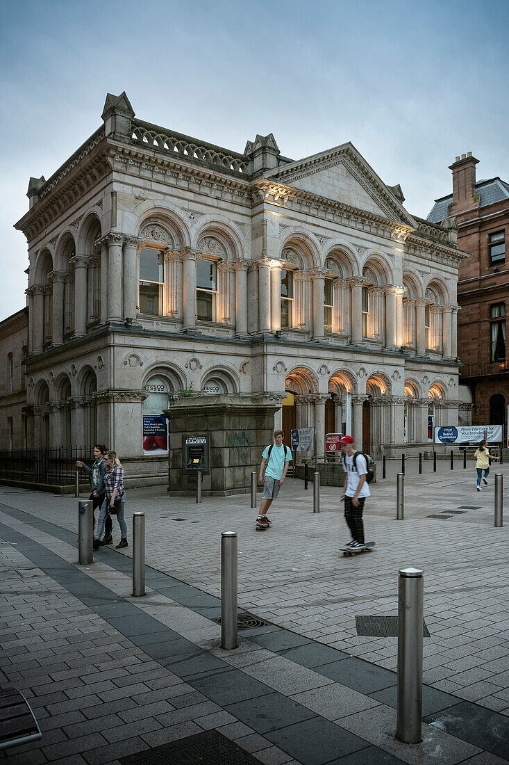 skaters in front of historical building, Belfast, Northern Ireland, United Kingdom, Europe