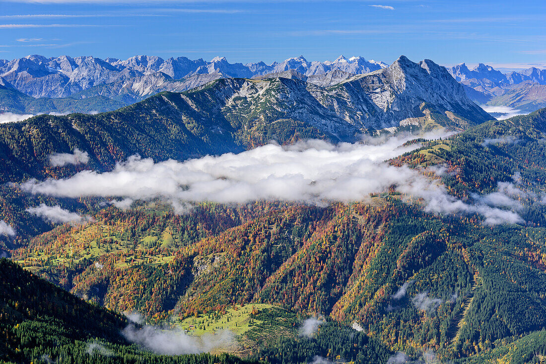 View towards Karwendel range and Guffert, fog in the valley, from Hinteres Sonnwendjoch, Bavarian Alps, Tyrol, Austria