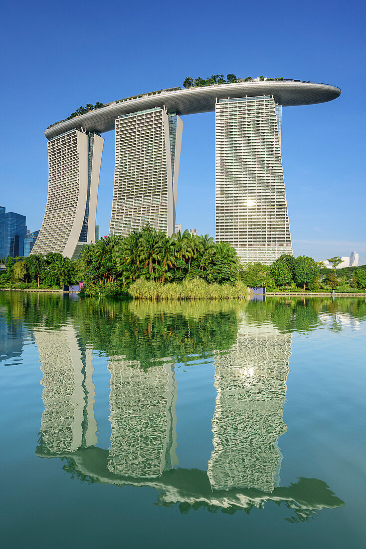 Marina Bay Sands reflecting in lake at Garden of the Bay, Marina Bay, Singapore