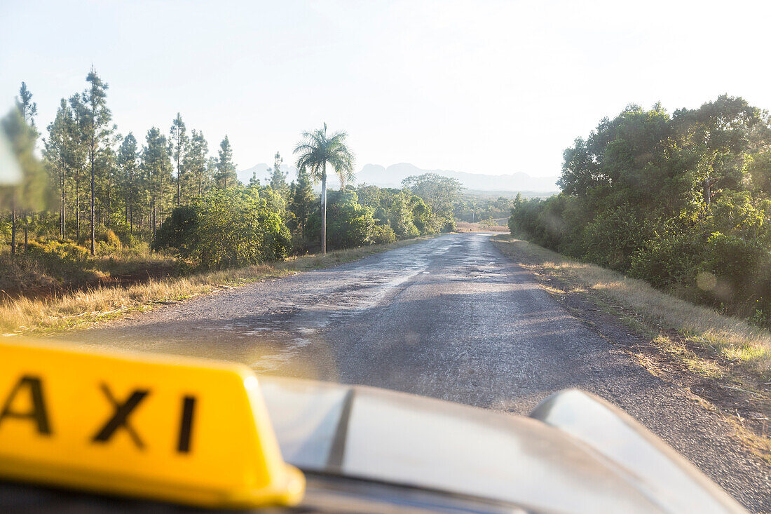 empty road to through the Cuban countryside from Vinales to Cayo Levisa, taxi, family travel to Cuba, parental leave, holiday, time-out, adventure, Cayo Levisa, day trip from Vinales, Pinar del Rio, Cuba, Caribbean island