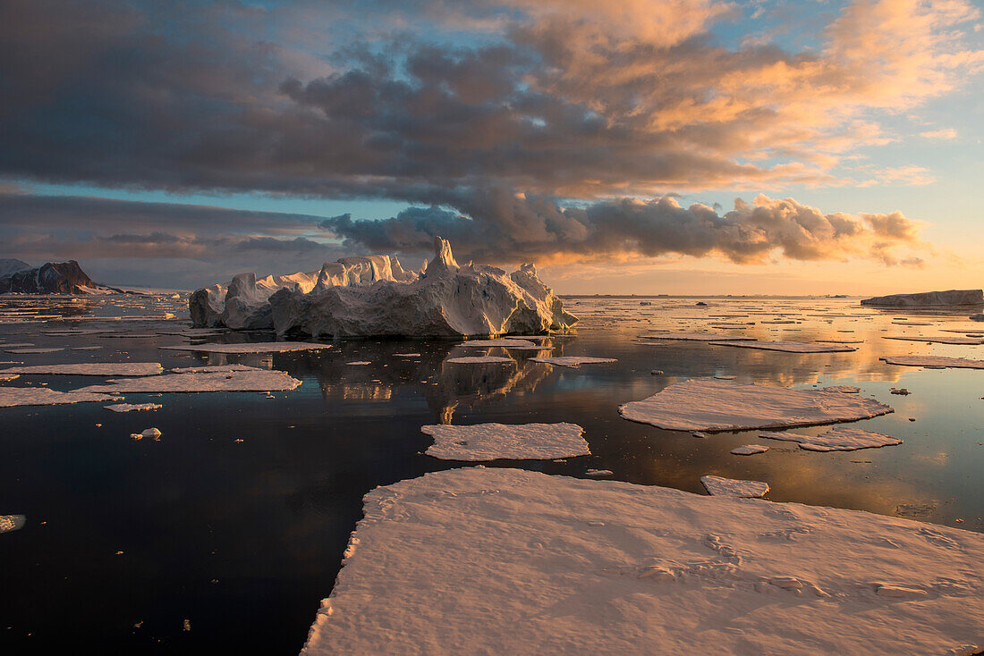 Late-evening sun falls on sea ice and icebergs, Marguerite Bay, near Rothera Station (GB), Adelaide Island, Antarctica