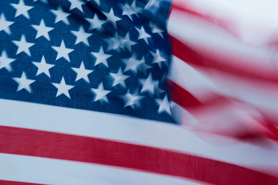 Long exposure of a fluttering American flag, Tracy Arm, Alaska, USA, North America