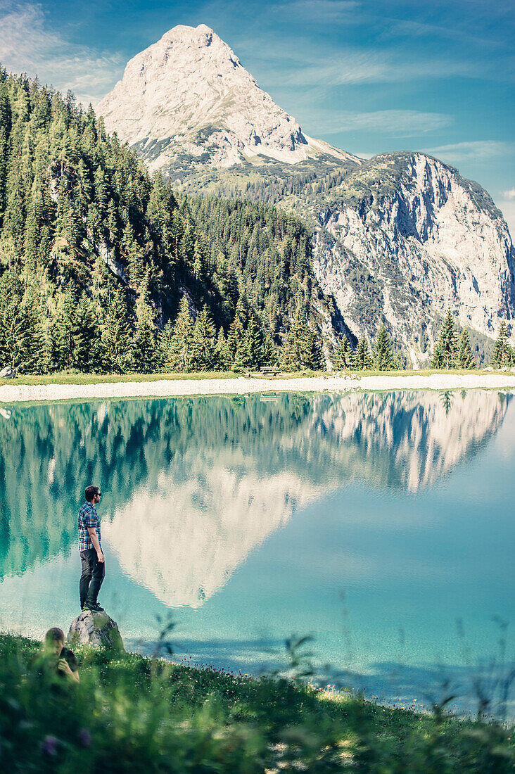 Hiker at Ehrwalder Almsee, Reutte, Tirol, austria, europe.