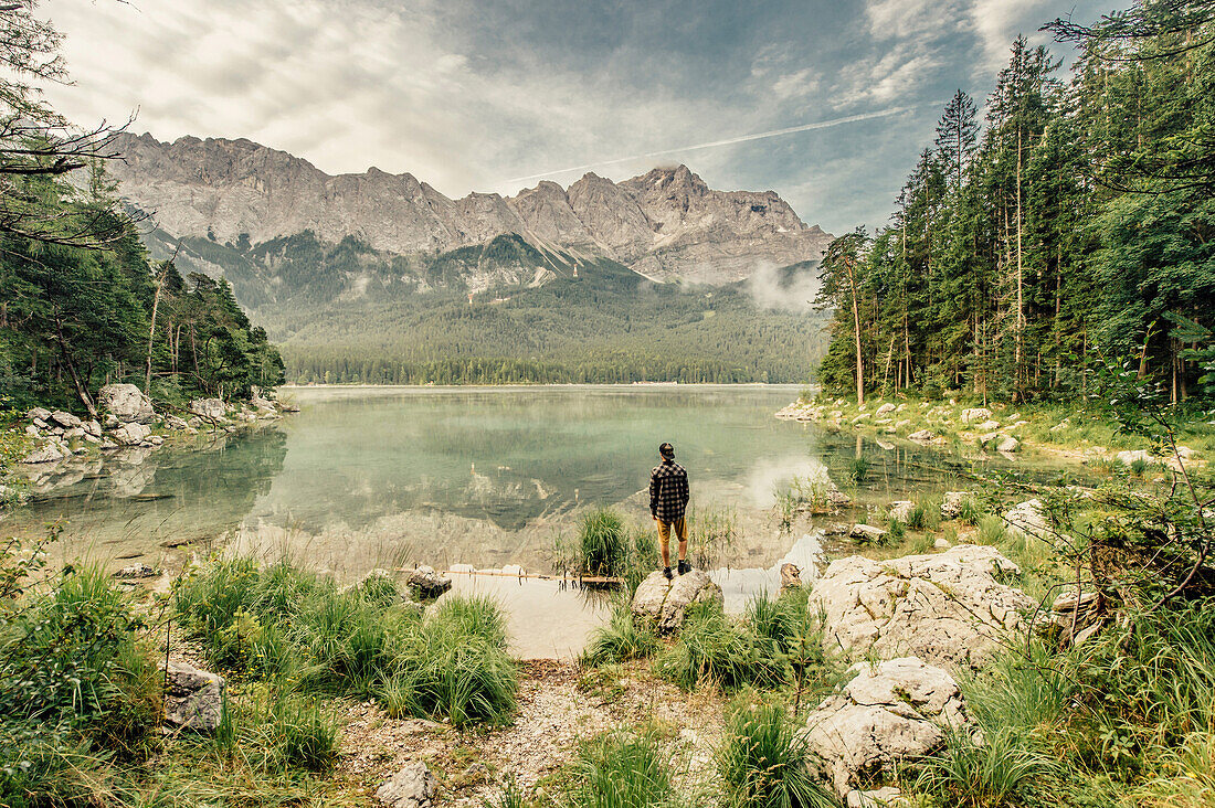 Hiker around Eibsee, Zugspitze, Garmisch, Bavaria, Germany, europe.
