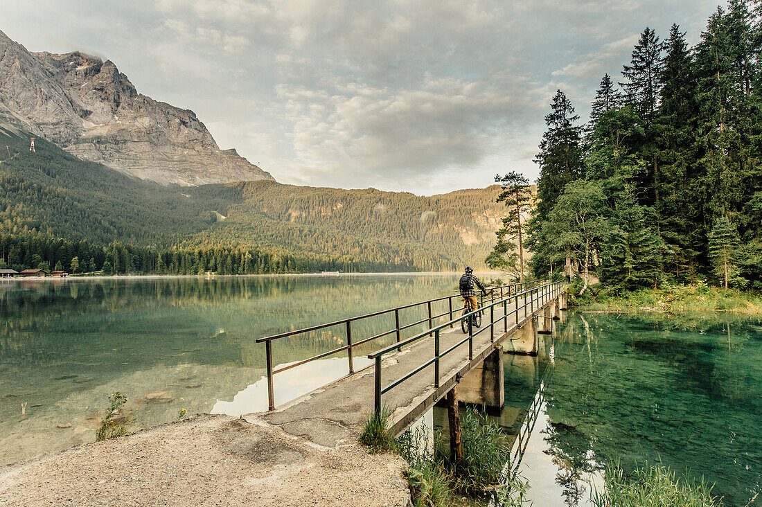 Biker around Eibsee, Zugspitze, Garmisch, Bavaria, Germany, europe.