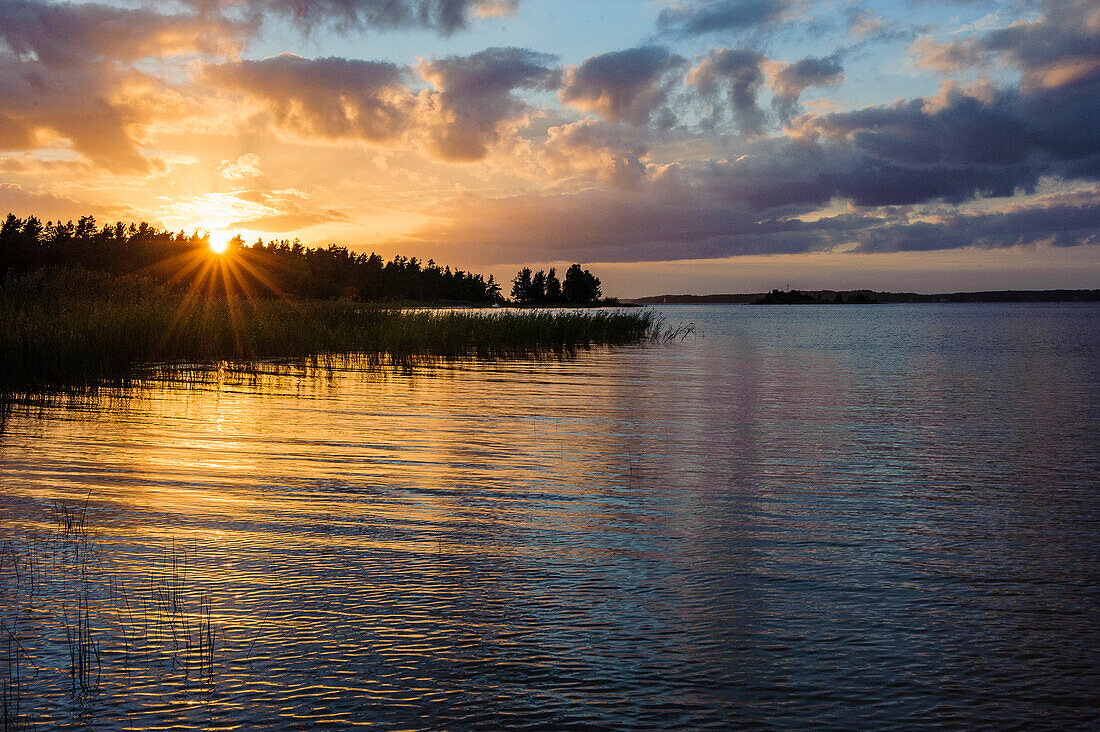Landscape with sunset at lake Vaener Torsoe island at Mariestad, Vänernsee, Sweden