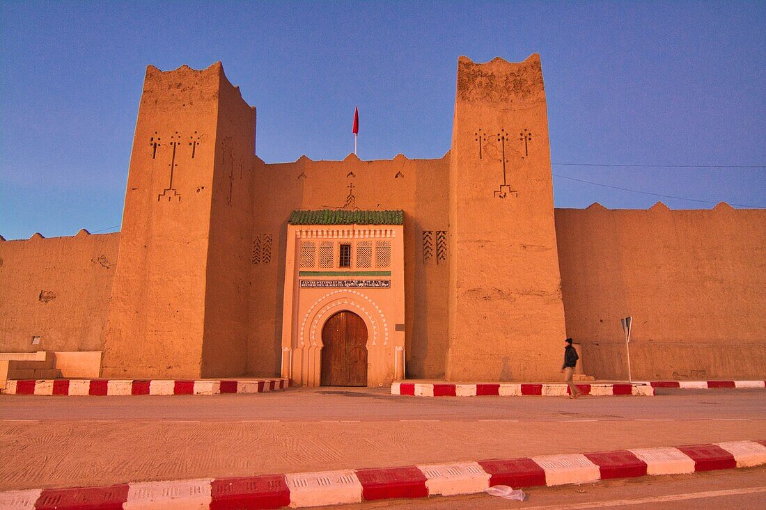 Mud-walled walls and fortress after sunset at Rissani in the Ziz Valley, Morocco