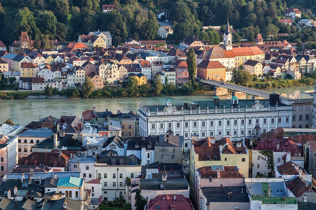 Top view of the typical buildings and houses set among green hills and river Passau Lower Bavaria Germany Europe.