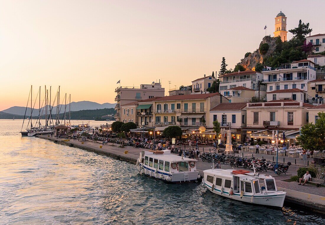 Sunset view of the waterfront of Poros Town, Poros Island, Greece.