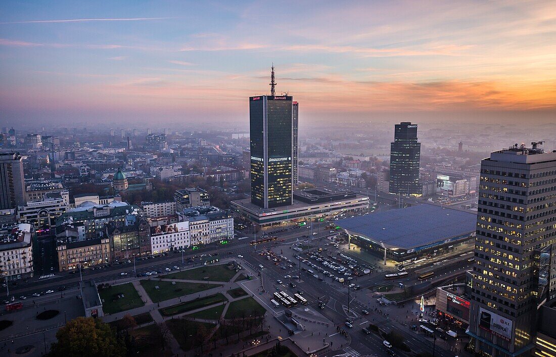 Sunset over Warsaw, Poland. View with Marriott Hotel, Central Railway Station, Golden Terraces mall.