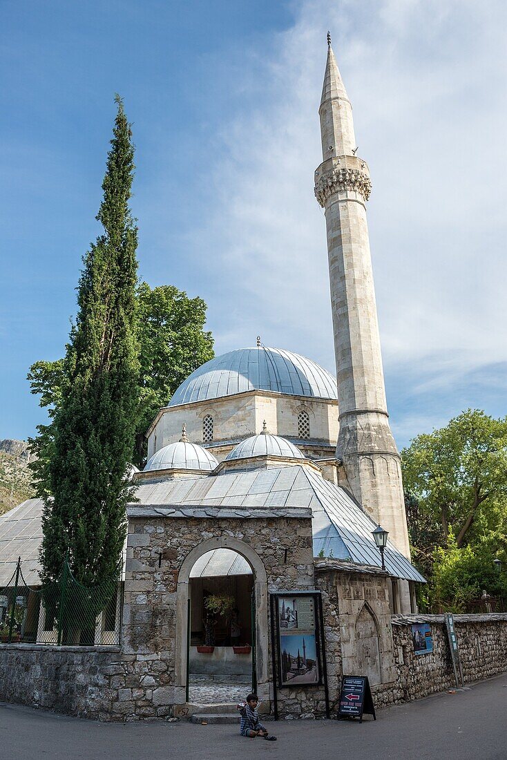 Karagoz Bey Mosque (Karadozbegova dzamija) at Brace Fejica pedestrian street in Mostar city, Bosnia and Herzegovina.