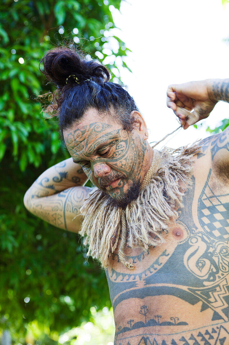 FRENCH POLYNESIA, Tahaa Island. Portrait of tattoo artist Tavita Monea at his home on Tahaa Island.