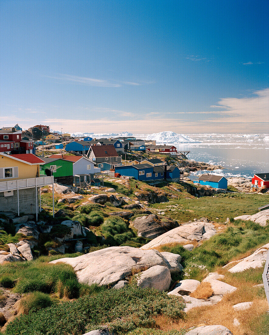 GREENLAND, Ilulissat, Disco Bay, exterior of houses with lake