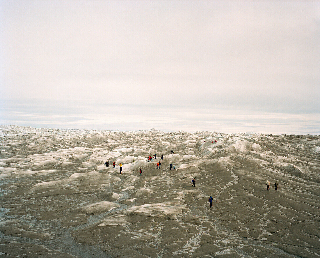 GREENLAND, Kangerlussuaq, Kangerlussuaq Ice Cap, tourists walking on ice cap