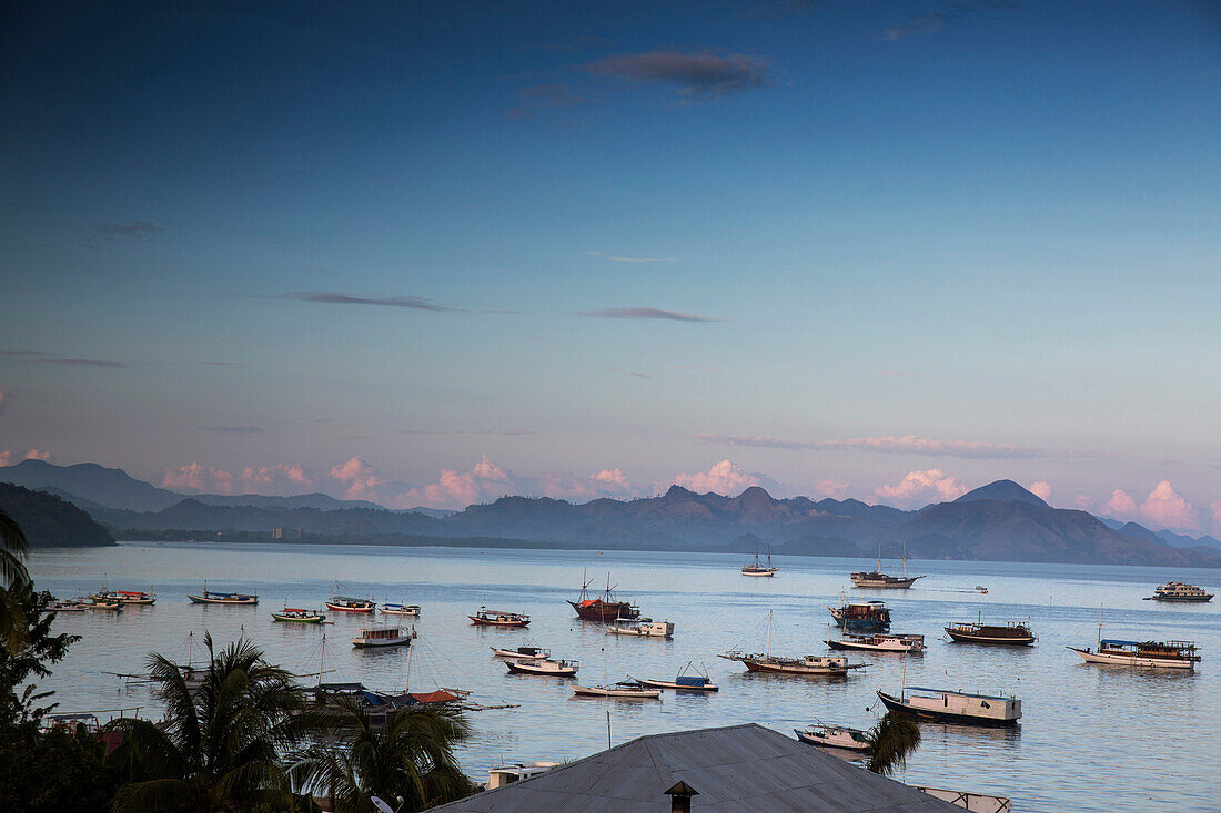 INDONESIA, Flores, boats anchored off the coast of Labuan Bajo at sunrise