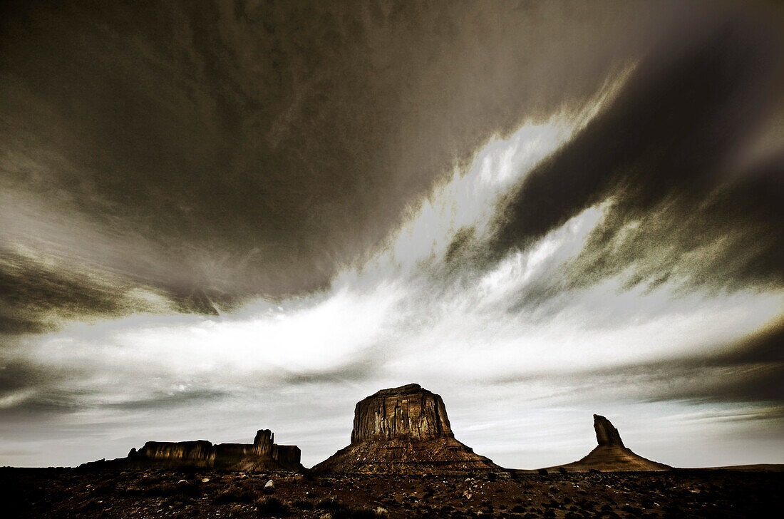 USA, Arizona, Utah; Monument Valley, Navajo Tribal Park, West Mitten Butte, East Mitten Butte, Merrick Butte and Sentinel Mesa, (B&W)