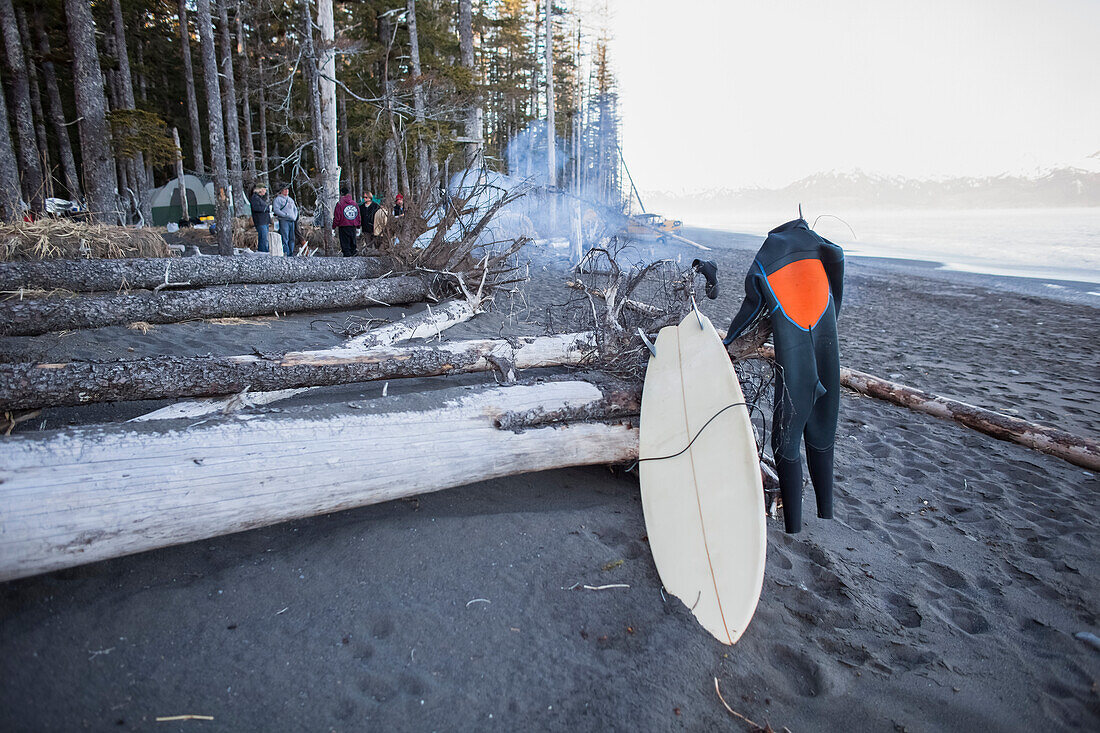 Surfers With Gear By A Campfire During A Surf Trip Near The Gulf Of Alaska, Southcentral Alaska, USA