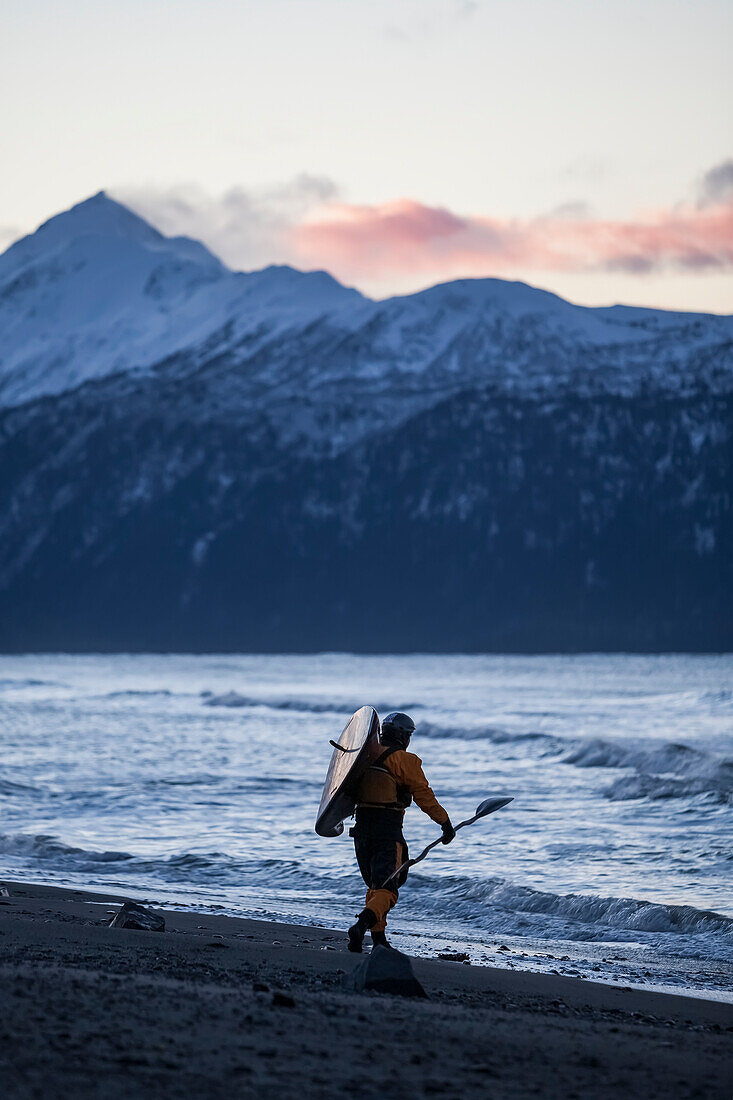 Kayaker Carries Kayak Into Kachemak Bay, Homer Spit, Southcentral Alaska, USA