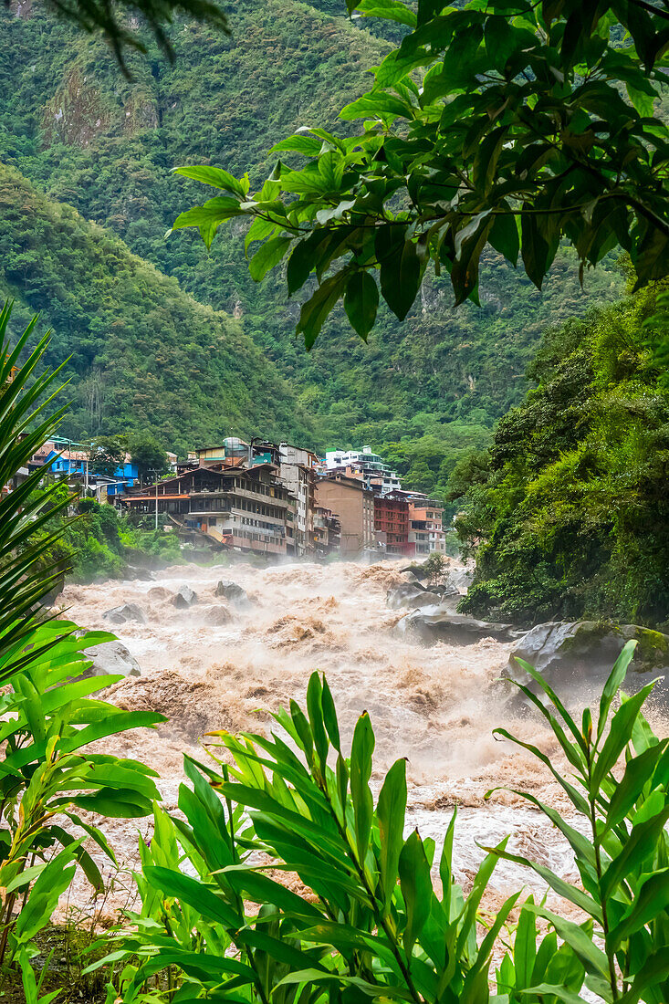The Town Of Aquas Calientes, Gateway To Machu Picchu, Located In The Andes Mountains With The Rushing Urubamba River; Aguas Calientes, Cuzco, Peru
