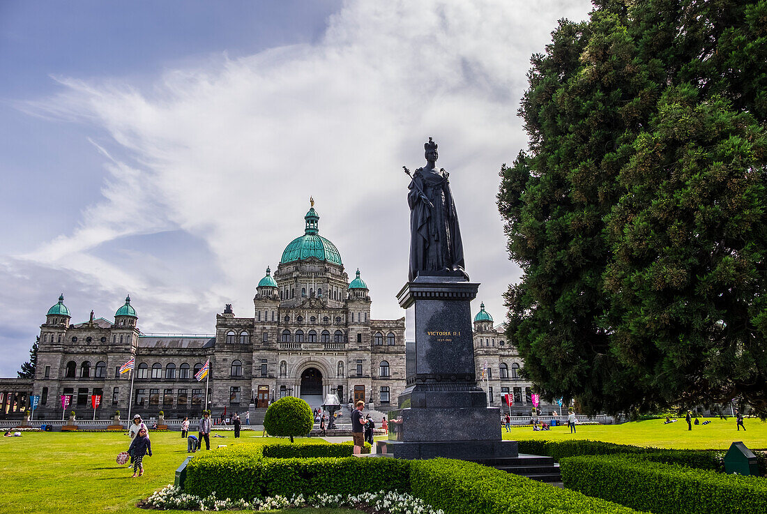 A Statue Of Queen Victoria Fronts The British Columbia Parliament Buildings; Victoria, British Columbia, Canada