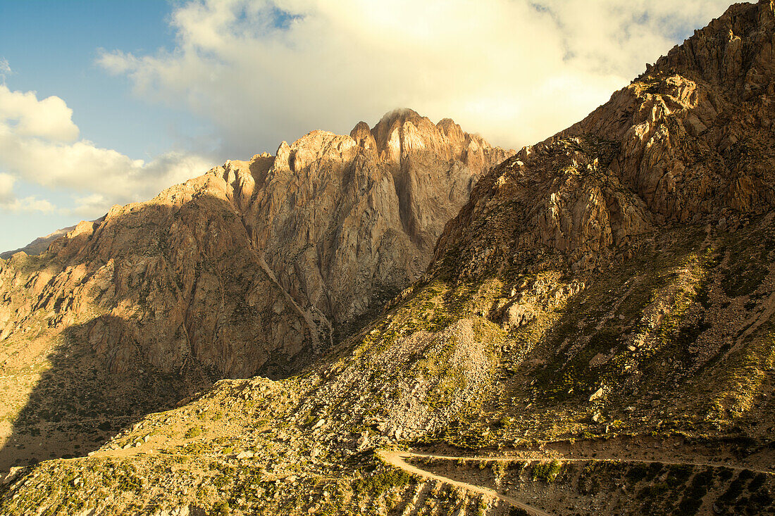Dirt Road On A Mountain Side In The Andes At Sunset; Mendoza, Argentina