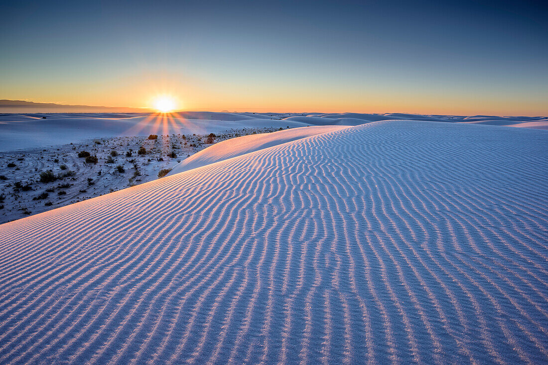 Sunrise over white sand dunes, White Sands National Monument, New Mexico, USA