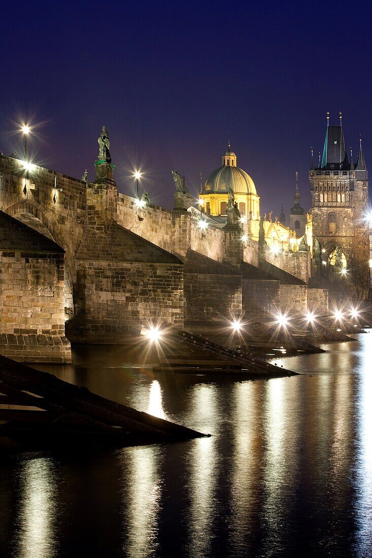 Czech republic prague - charles bridge and spires of the old town at dusk.