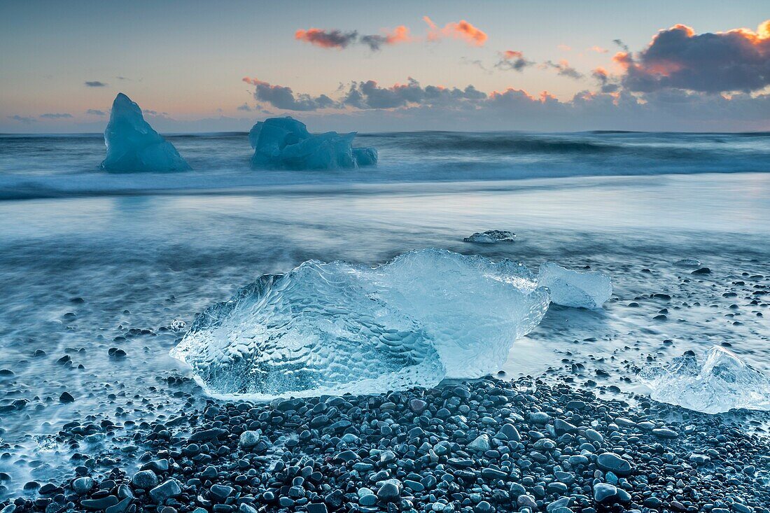 Block of ice on the black beach in Jokulsarlon Glacier Lagoon, Eastern Iceland, Europe.