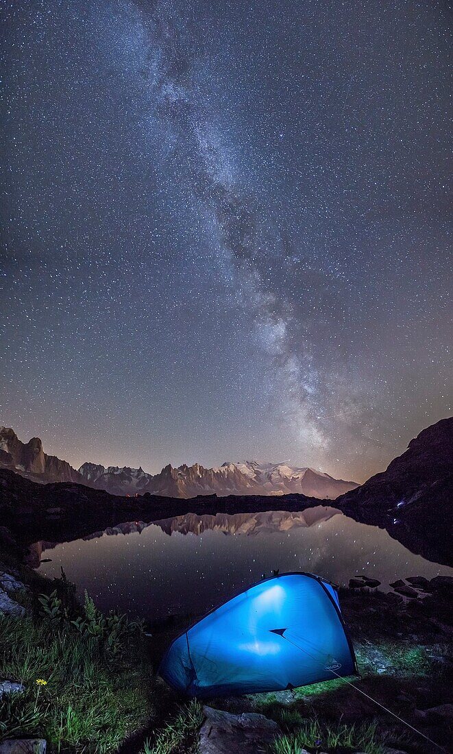 Camping under the stars at Lac de Cheserys. In the background the range of Mont Blanc. Haute Savoie. France.