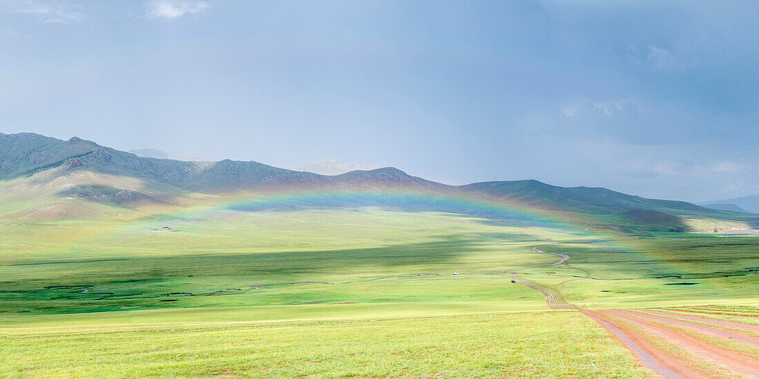 Rainbow over the green Mongolian steppe, Ovorkhangai province, Mongolia