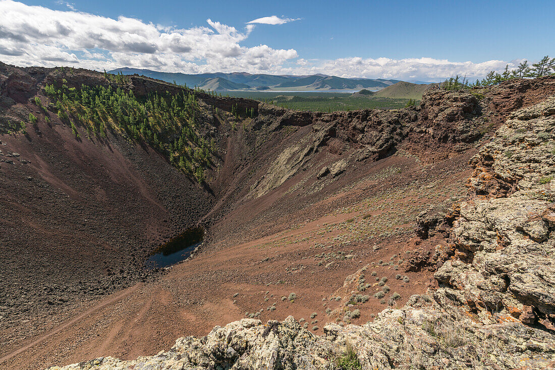 Khorgo volcano crater and White Lake in the background. Tariat district, North Hangay province, Mongolia.