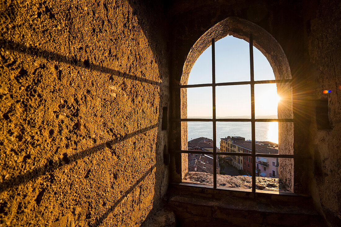 Sirmione, lake Garda, Brescia province, Lombardy, Italy. Inside of the Scaliger Castle's tower at sunset.