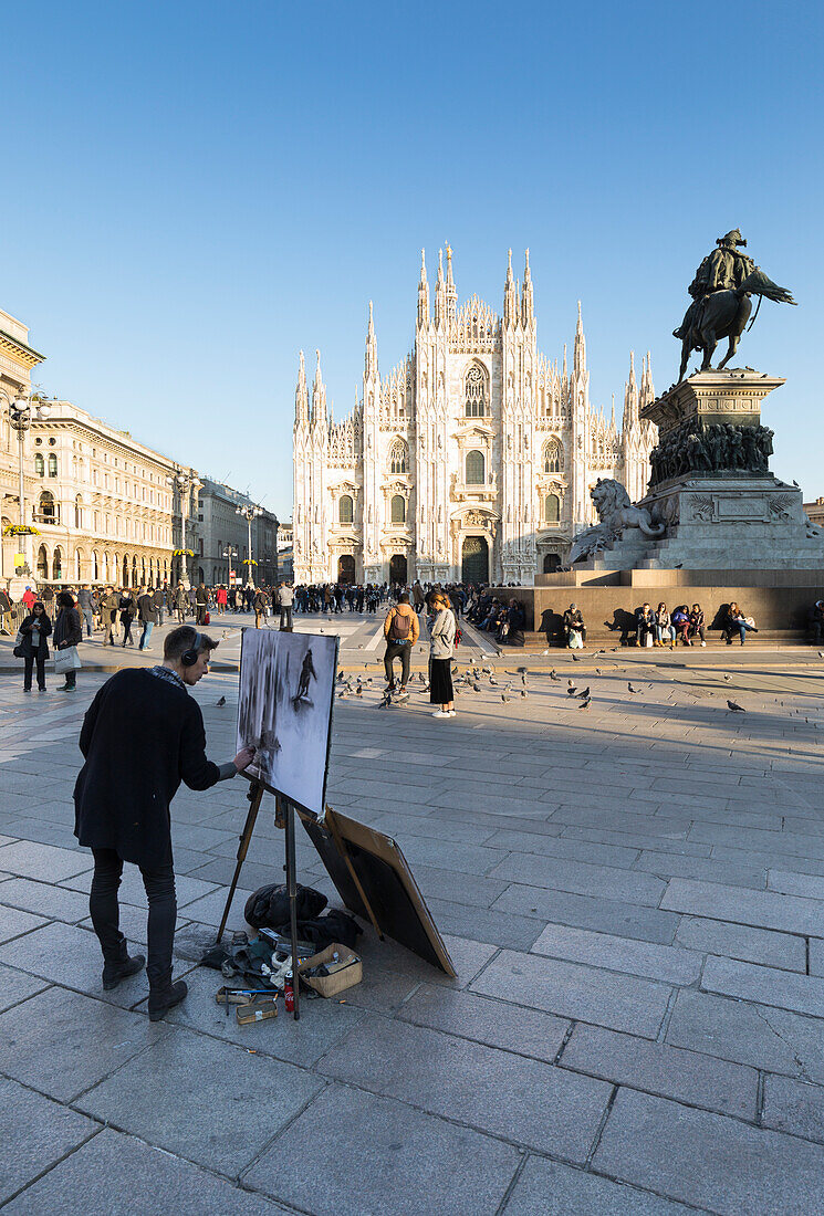 a view of a street painter at the Piazza del Duomo drawing the Milan Cathedral, Milan province, Lombardy, Italy