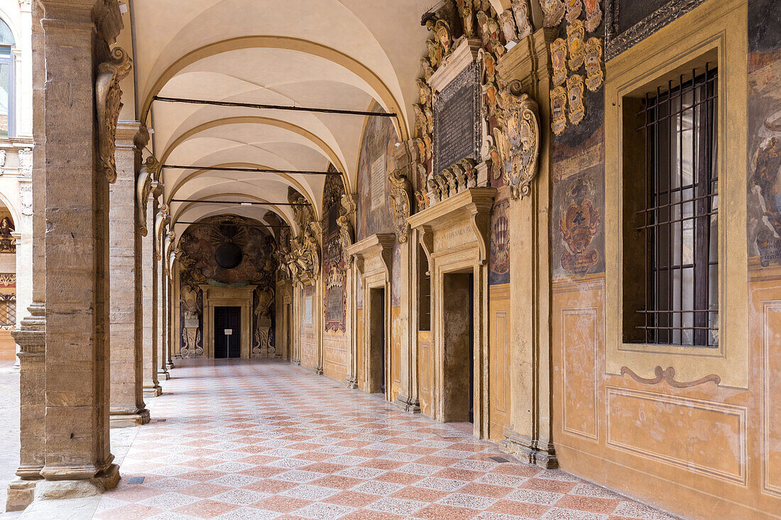 Portico on the internal courtyard of the Archiginnasio, Bologna university, Bologna, Emilia Romagna, Italy