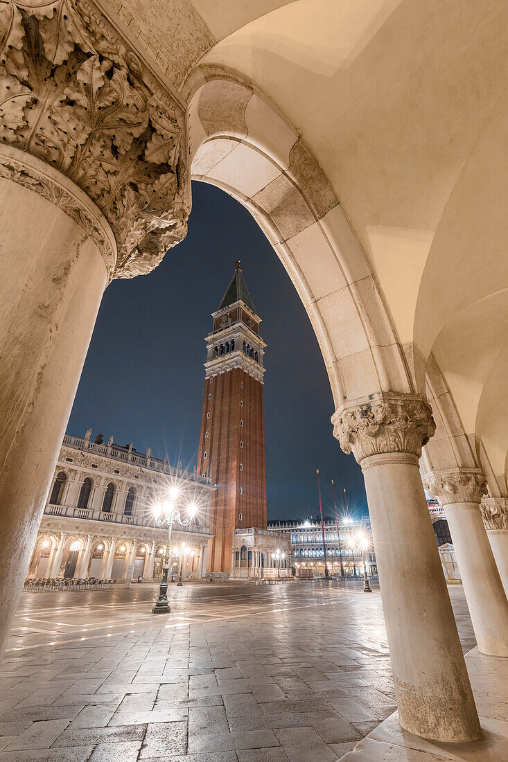 St, Mark’s bell tower seen from the colonnade of Doge’s Palace, Venice, Veneto, Italy