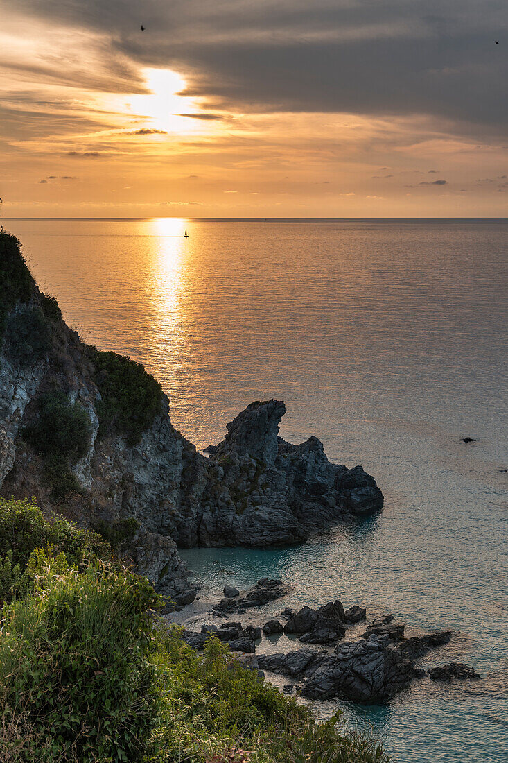 Zambrone, province of Vibo Valentia, Calabria, Italy, Europe. Sunset on the beach of Lion's rock