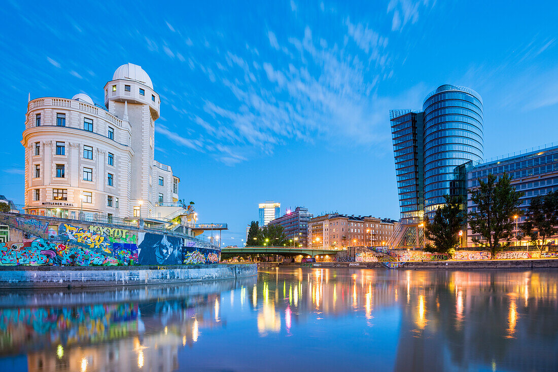vienna, Austria, Europe. The Urania and the Uniqa Tower reflected in the Danube Canal