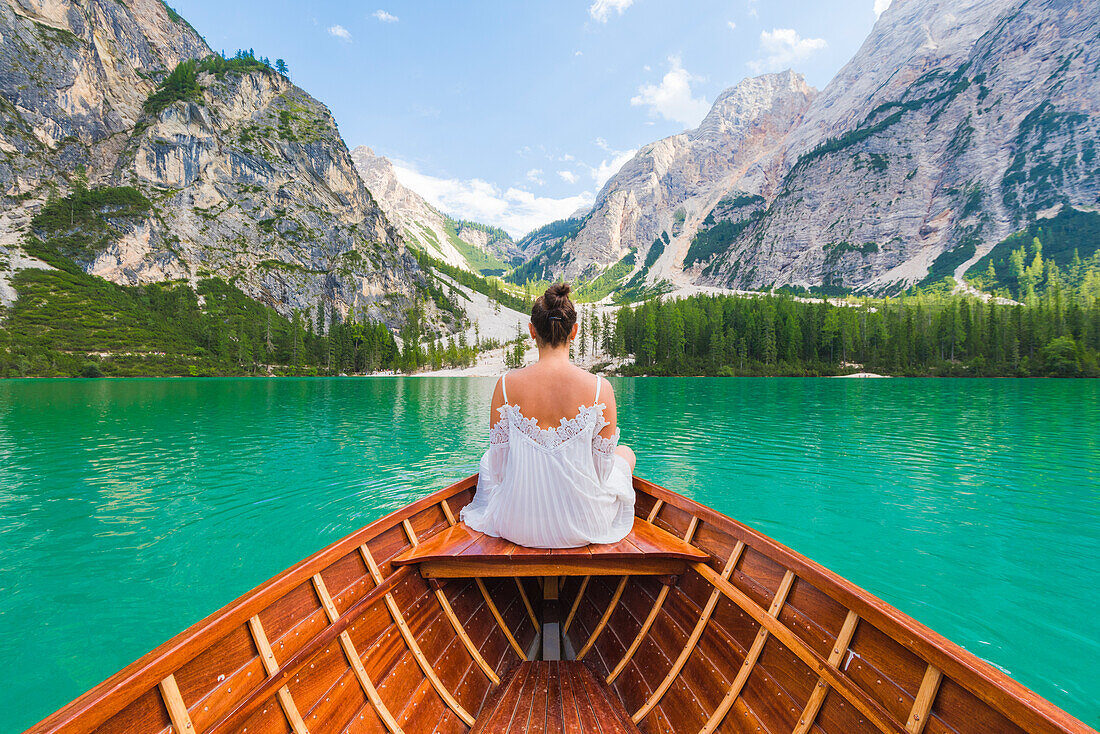 Lake Braies,Braies,Bolzano province,Trentino Alto Adige,Italy Girl admires the Braies Lake by boat