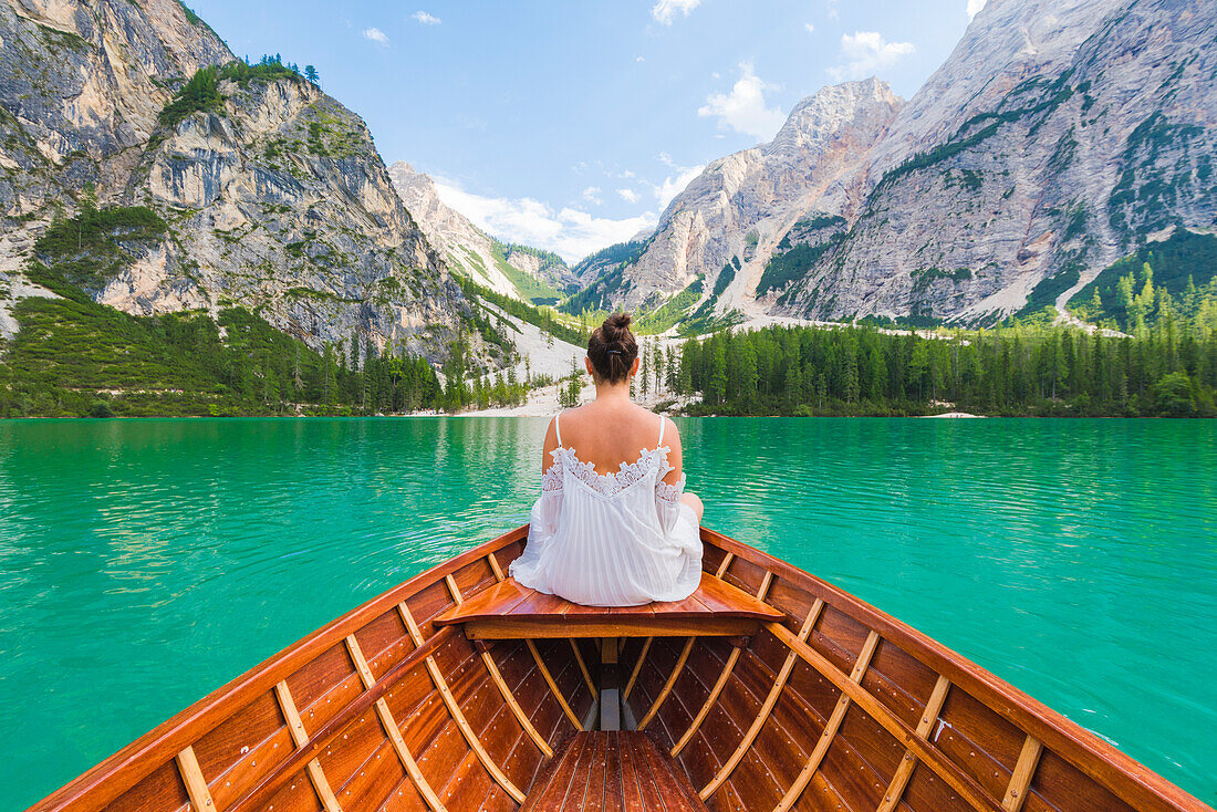 Lake Braies,Braies,Bolzano province,Trentino Alto Adige,Italy Girl admires the Braies Lake by boat.