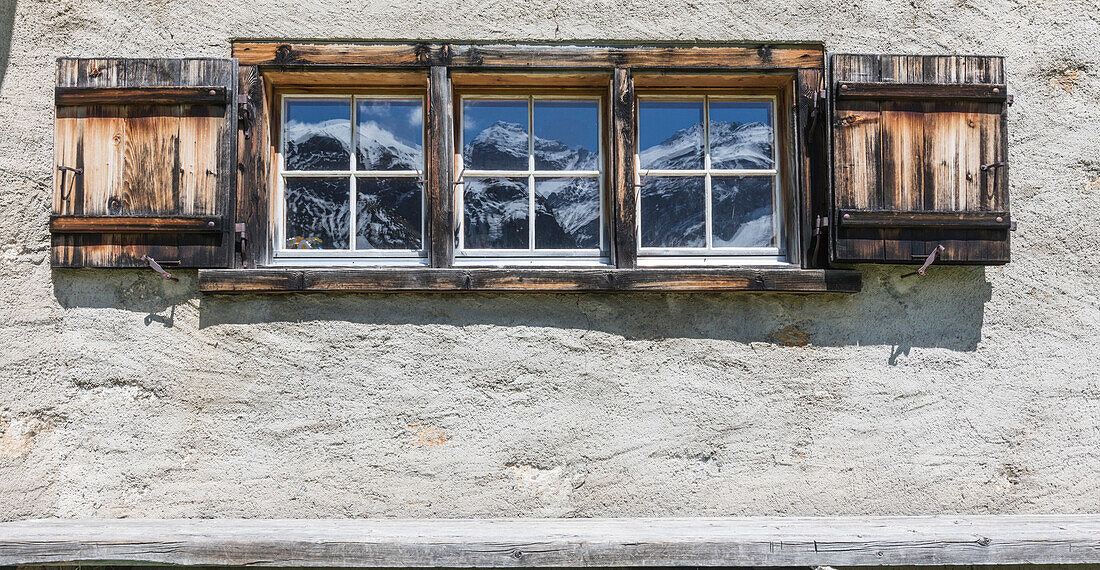 Details of wooden window of a typical alpine house in Davos, Sertig Valley, canton of Graubünden, Switzerland