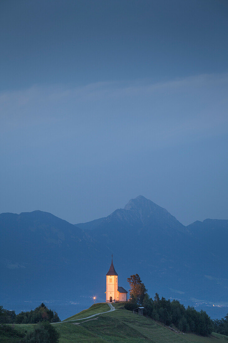 The iconic Jamik church, with Mount Triglav on the background, Jamnik, Kranj, Upper Carniola, Slovenia