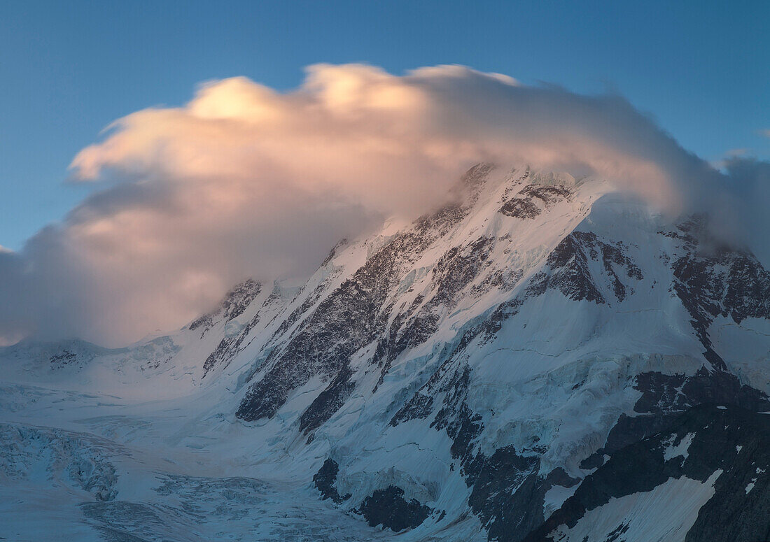 View at dawn of the mountain Liskamm covered by clouds and Lis glacier part of the Mount Rosa massif, Zermatt Canton of Valais Pennine Alps Switzerland Europe